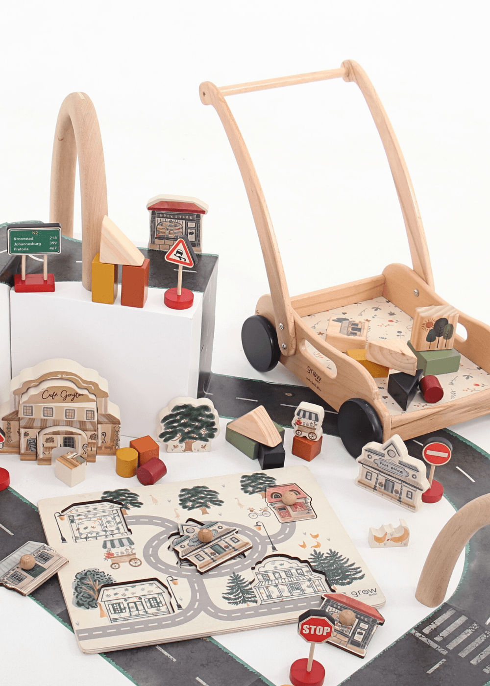 Wooden toy block push cart with 32-piece set including building blocks and street signs for creative play.