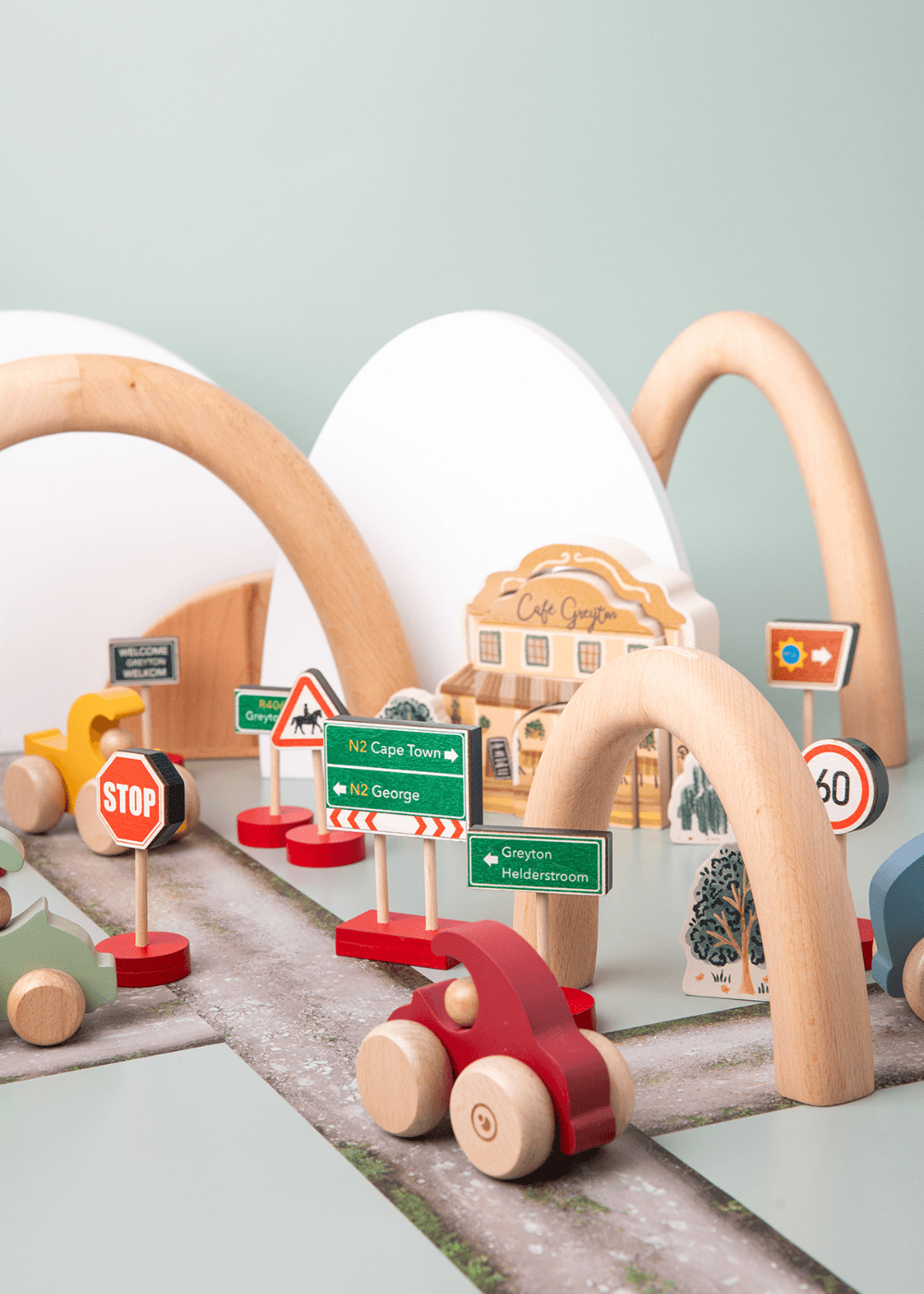 Wooden Road sign toy set with mini cars and road signs for imaginative play and learning road rules.