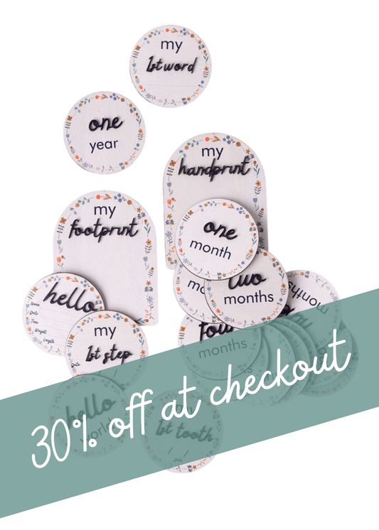 Wooden Baby Milestone disc gift set featuring various milestone discs with promotional text 30% off at checkout.