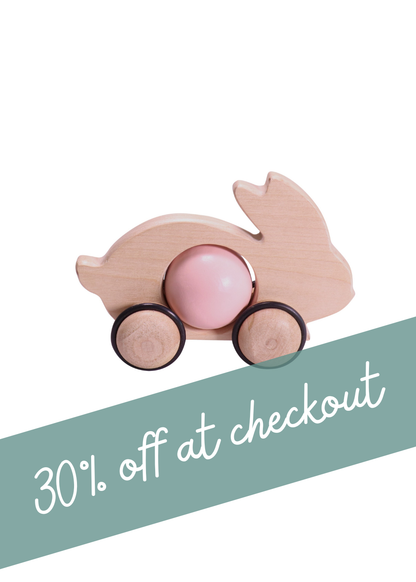 Bunny Push Toy in pastel pink on wheels, promoting 30% off at checkout, perfect for active play.