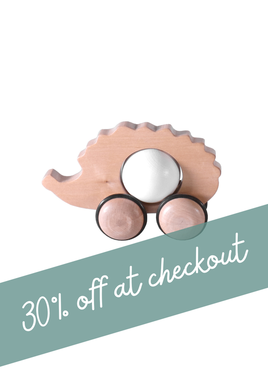 Wooden hedgehog push toy for kids with wheels and a promotional 30% off at checkout.