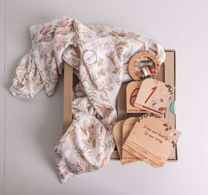 Baby Gift Set including Maccie swaddle, milestone disks, and rattle, beautifully curated for newborns.