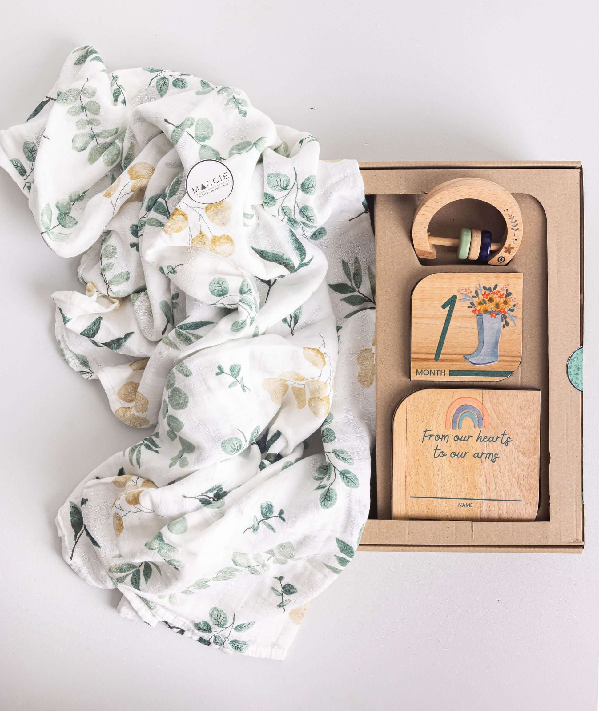 Baby Gift Set featuring Maccie Swaddle, milestone disks, and rattle in a beautiful gift box.