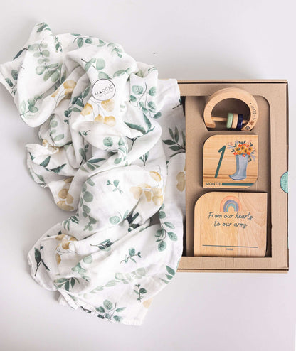 Baby Gift Set featuring Maccie Swaddle, milestone disks, and rattle in a beautiful gift box.