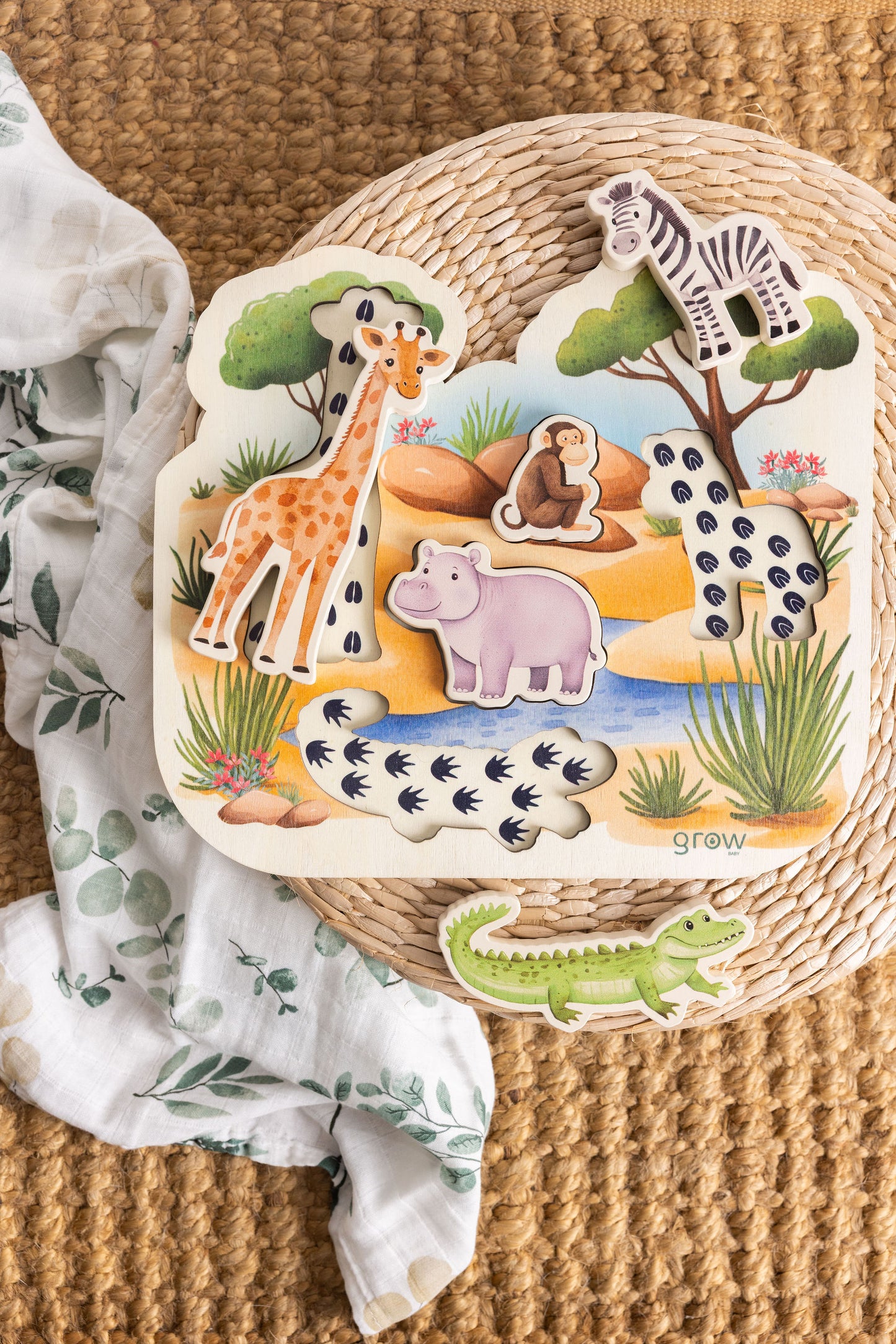 Wooden Chunky Puzzle featuring African animals at a watering hole, perfect for toddlers' play and learning.