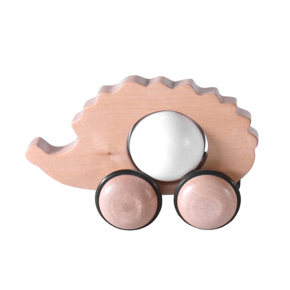Wooden hedgehog push toy for kids with smooth wheels, perfect for imaginative play and early childhood development.
